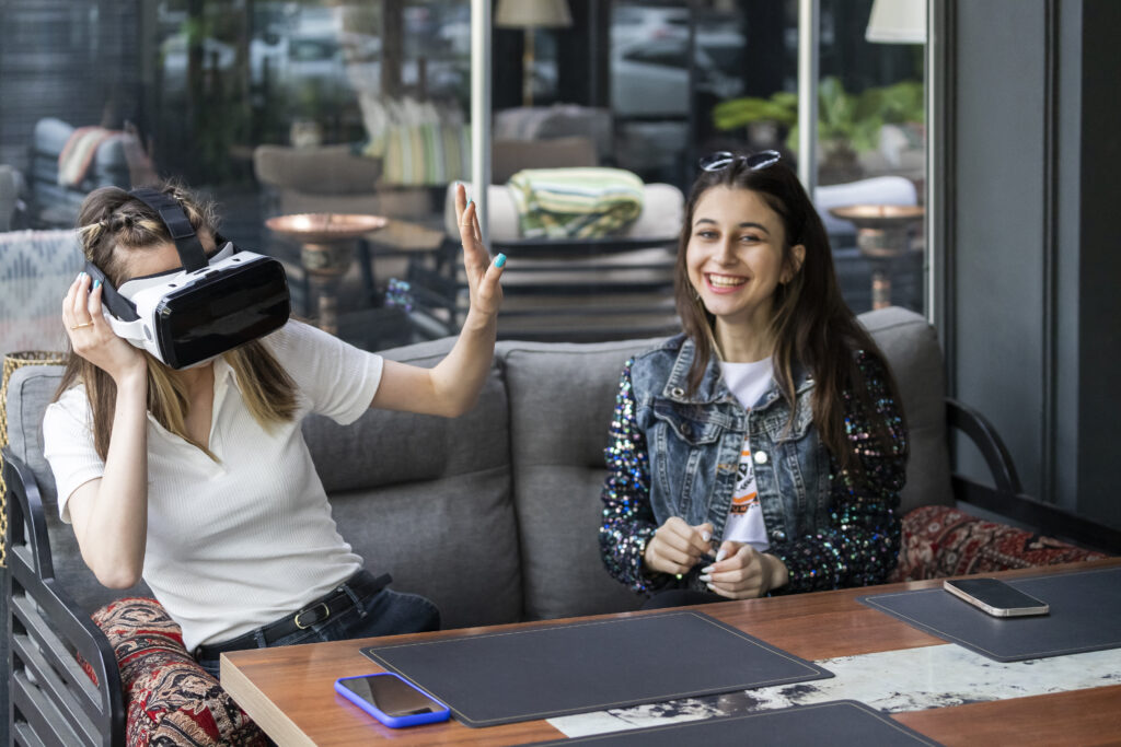 young-lady-wearing-vr-set-gesture-her-friend-stop