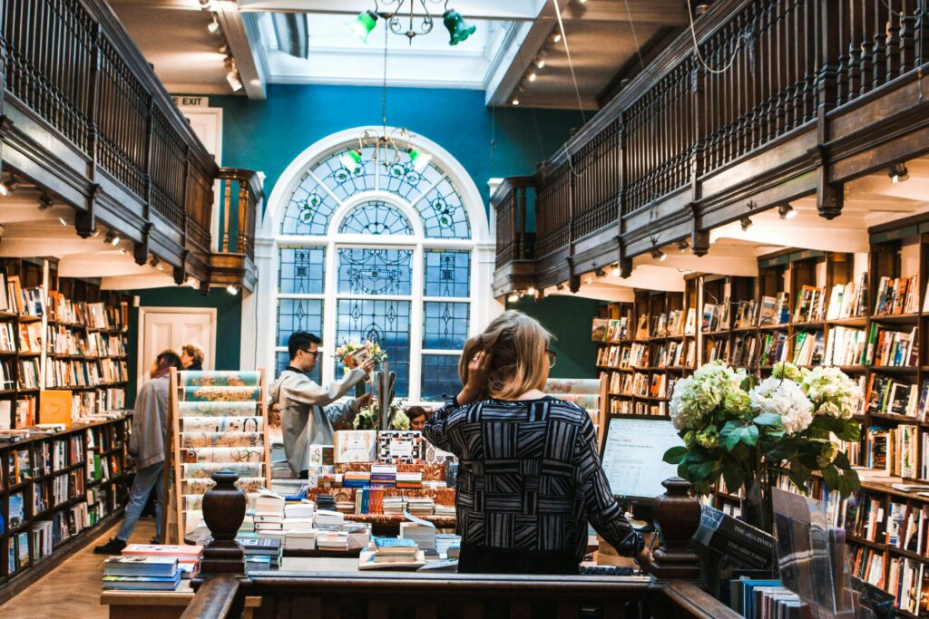 An-open-book-with-pages-turning-or-a-stack-of-books